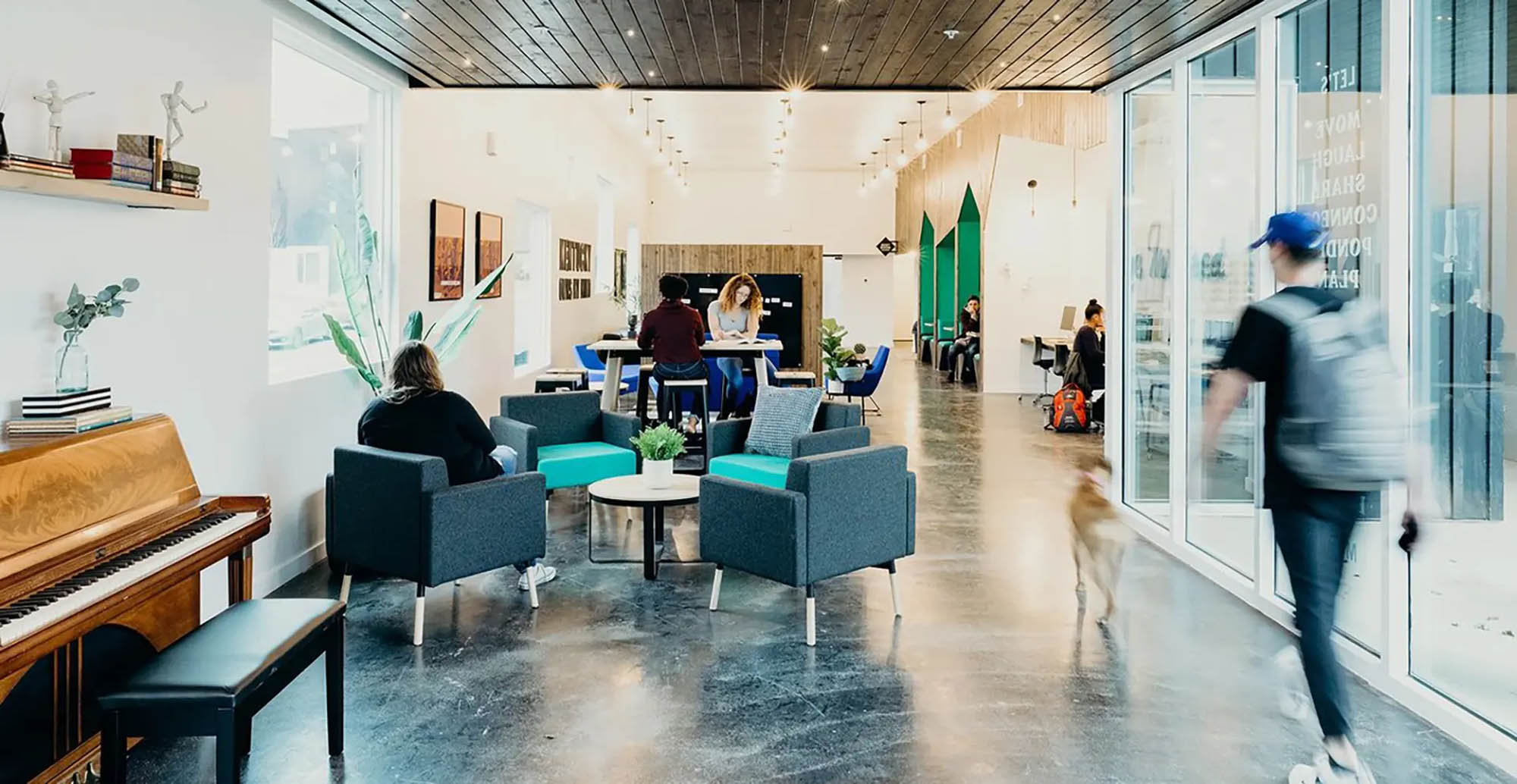 Clubhouse filled with residents reading and studying
