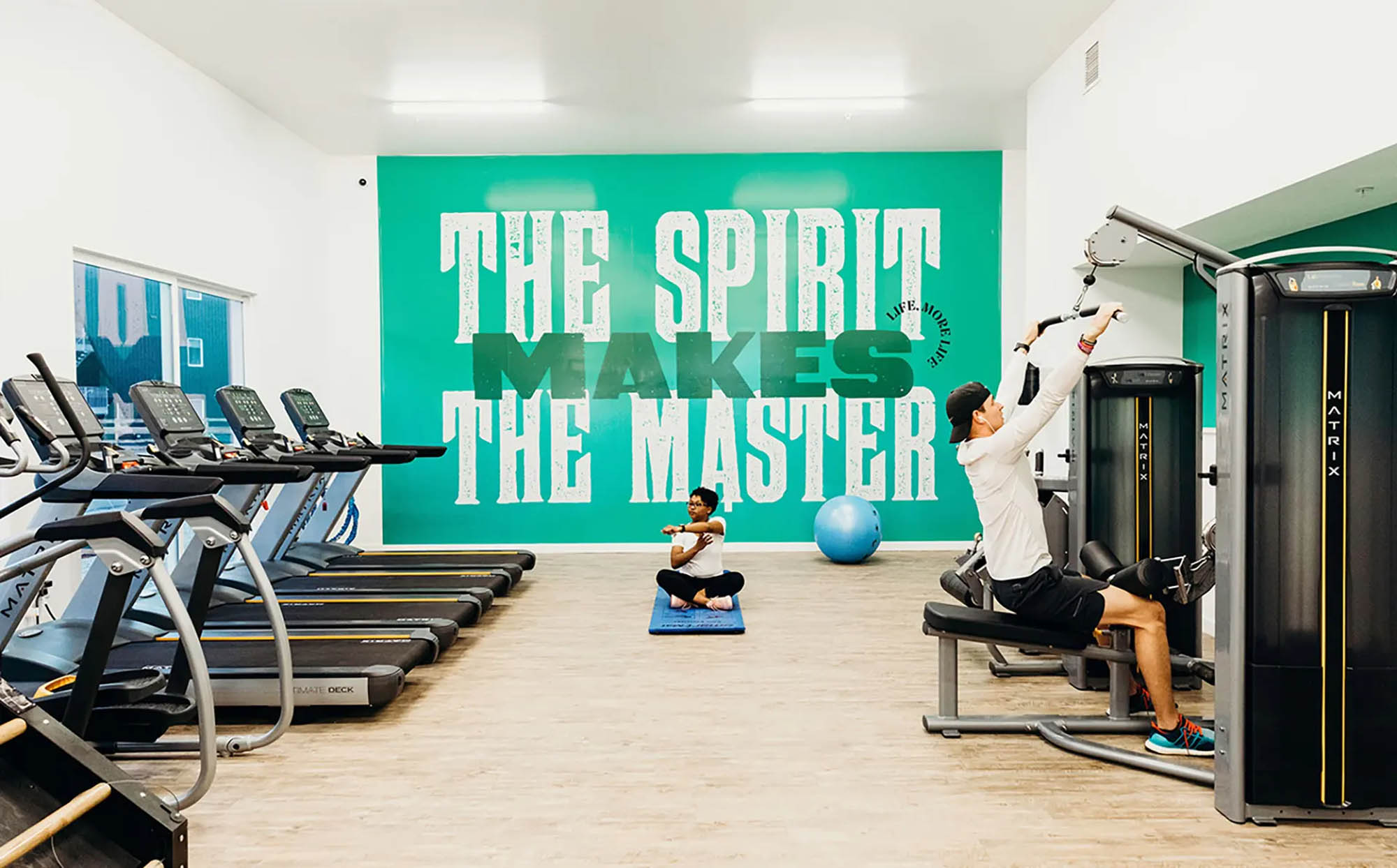 Fitness center with residents using equipment