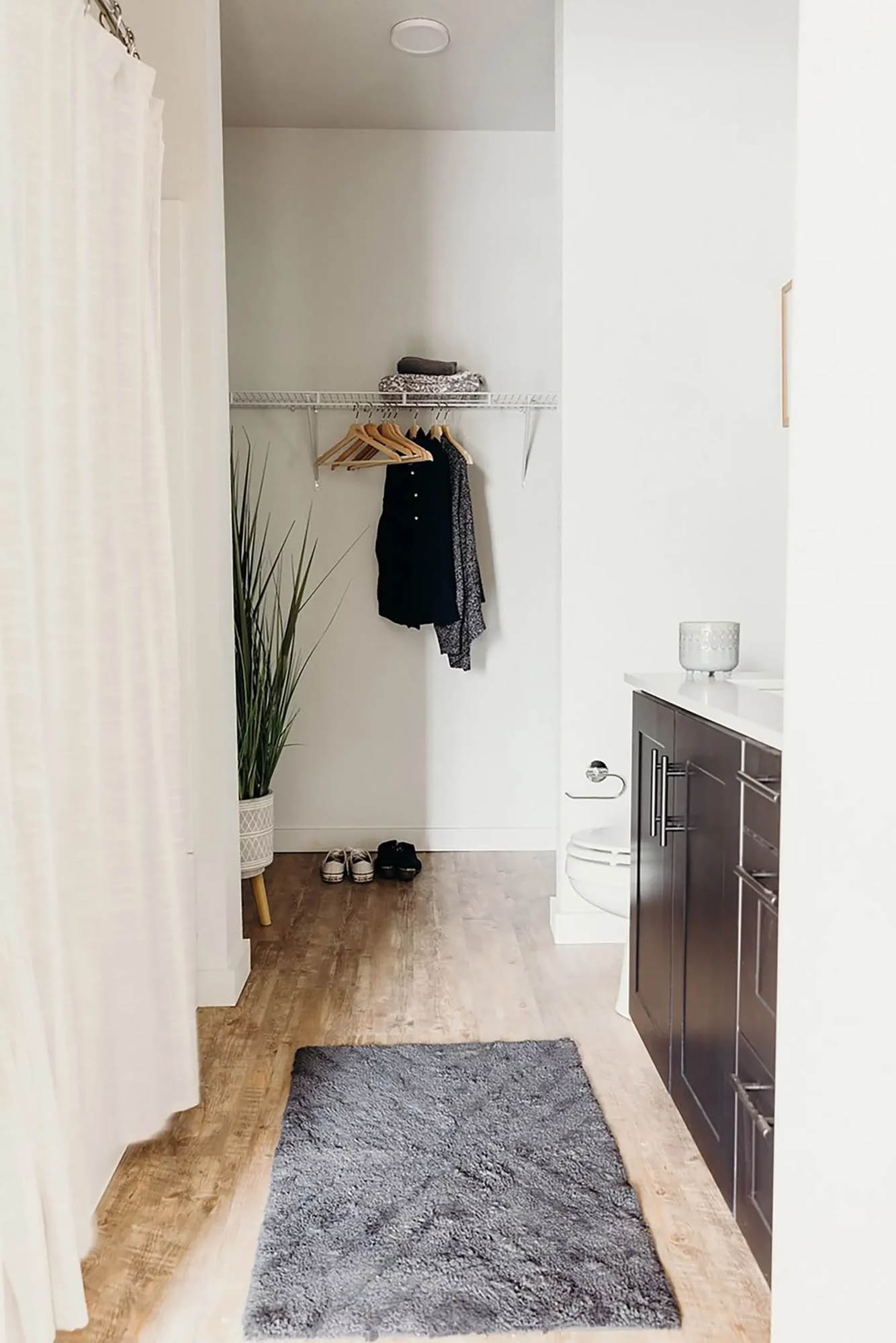 Modern, clean closet inside of bathroom